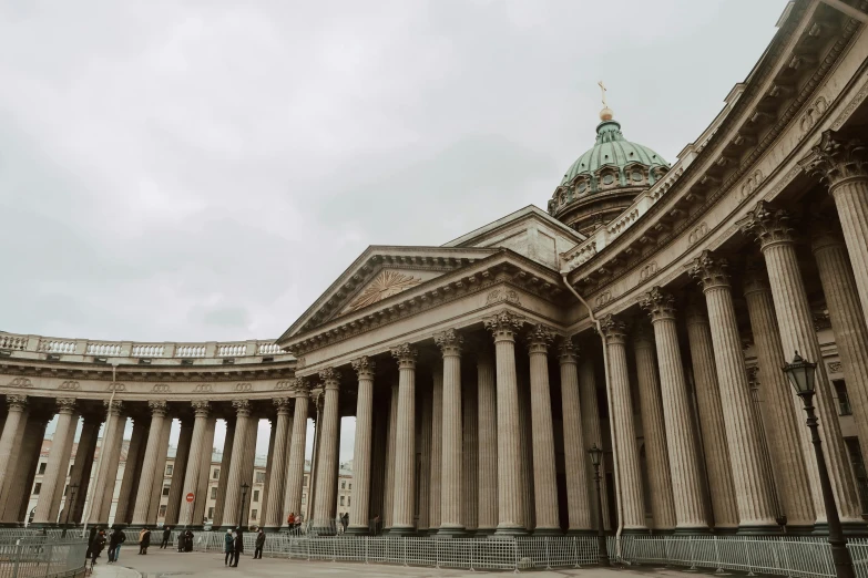 the columns of a large circular building that looks like a church