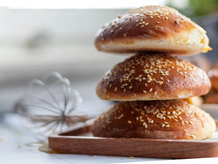 three bagel buns stacked up on top of each other