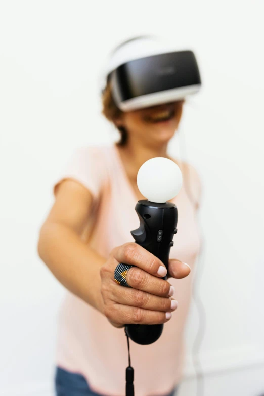 a woman using a vr headset to adjust a device