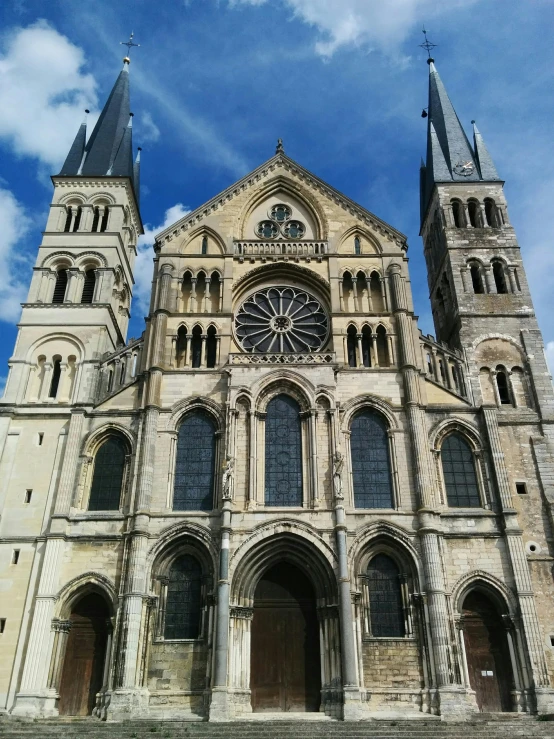 a church with multiple steeples is shown against a blue sky