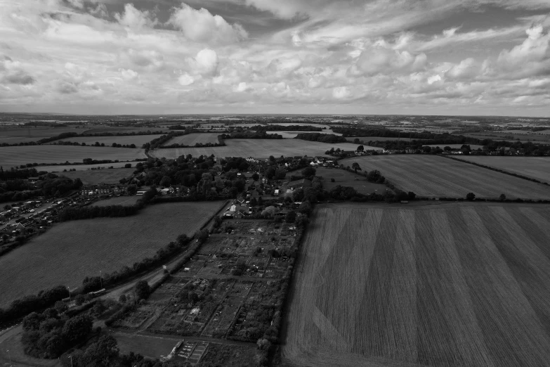 an aerial s of farmland in black and white
