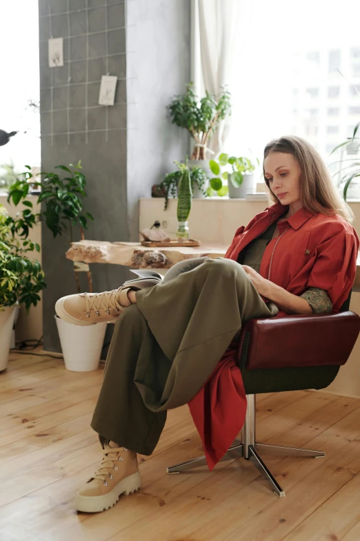 a woman is sitting in an office chair