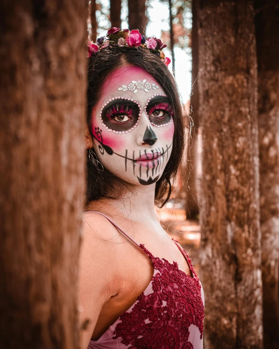 the woman in the red dress is wearing skeleton makeup