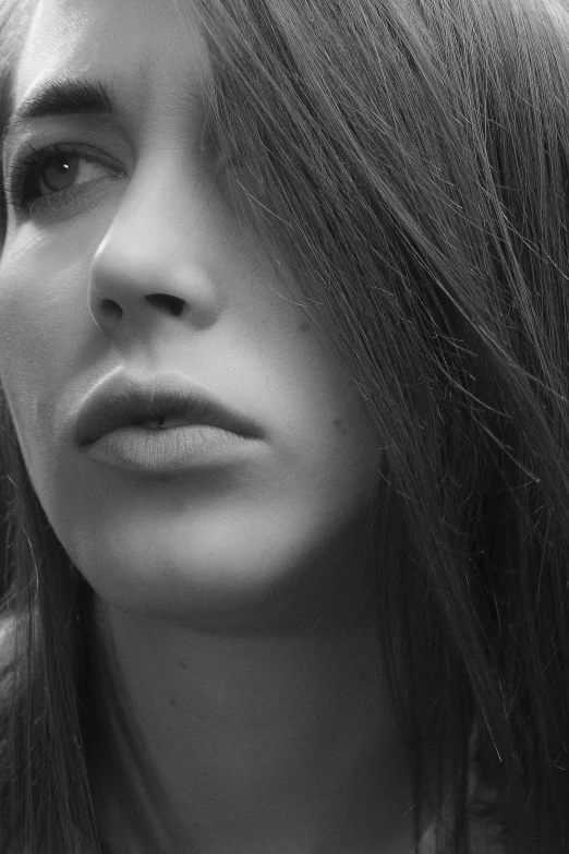 black and white image of young woman with long hair