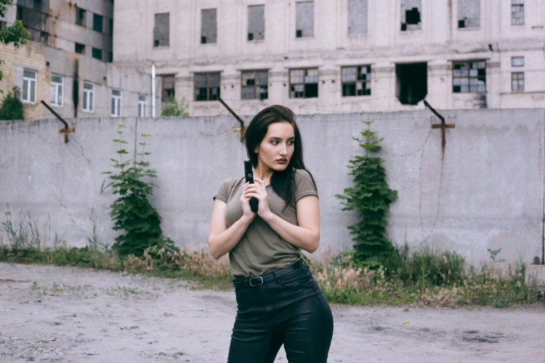 the woman is standing in front of an old building holding an umbrella