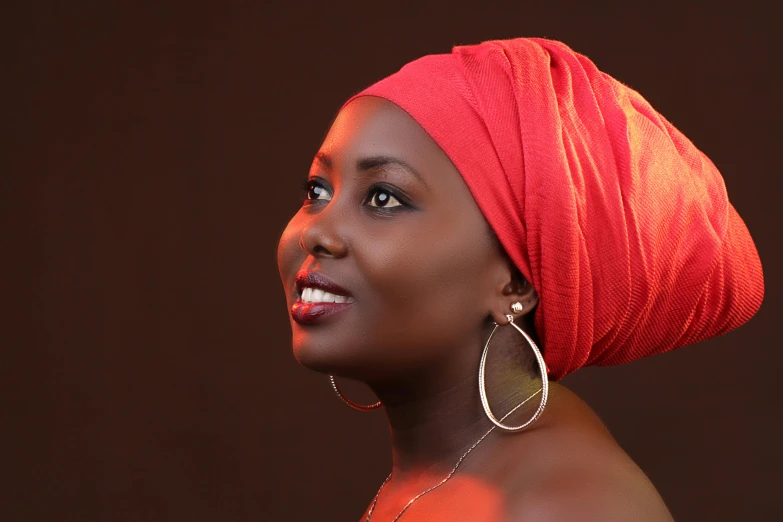 a woman wearing a red scarf on her head