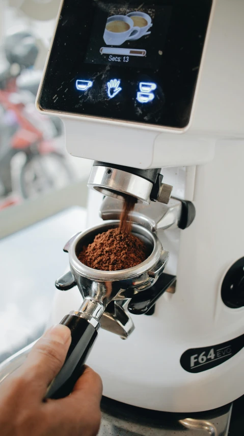 coffee machine with espresso spilling into it