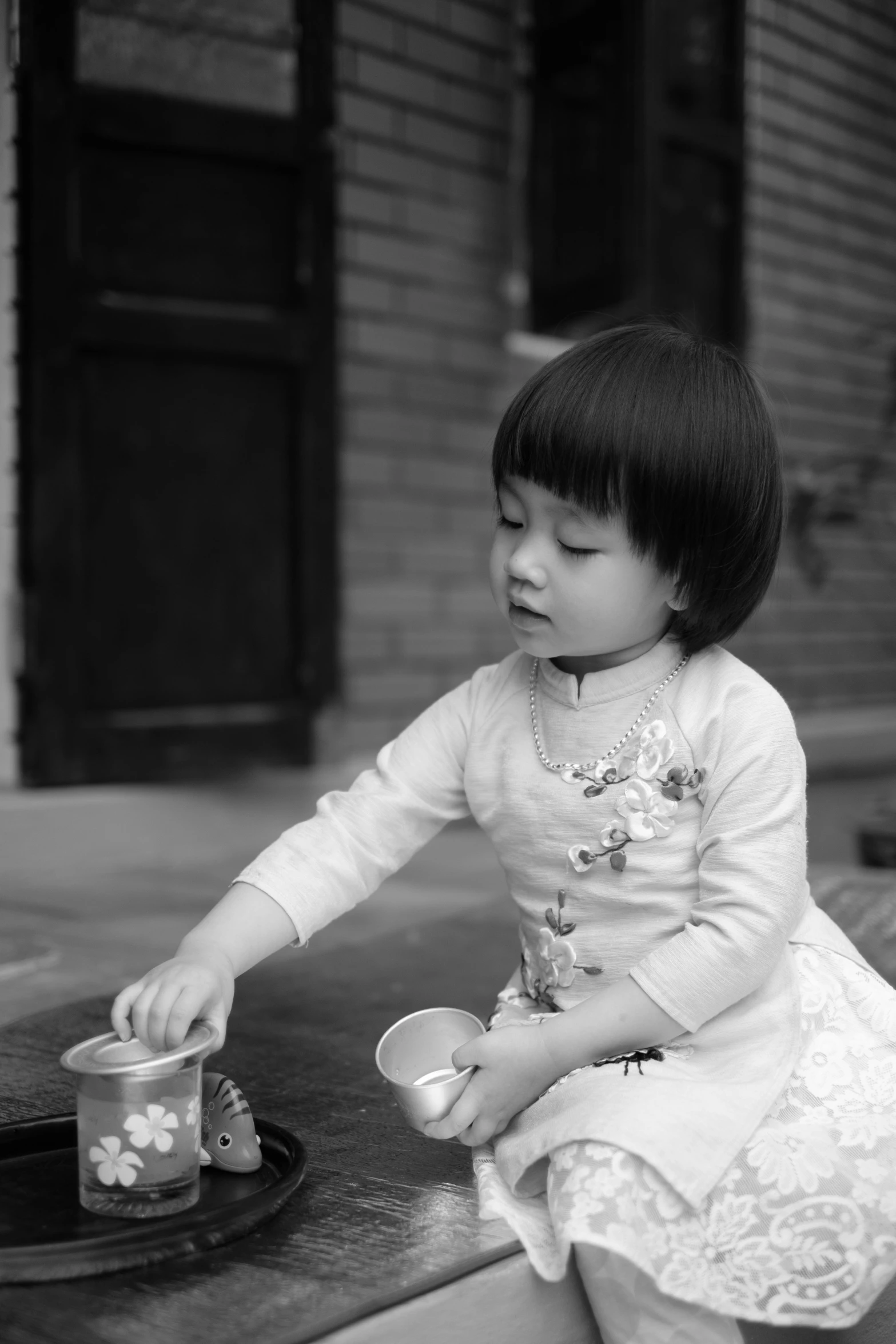 an asian girl with food on the ground