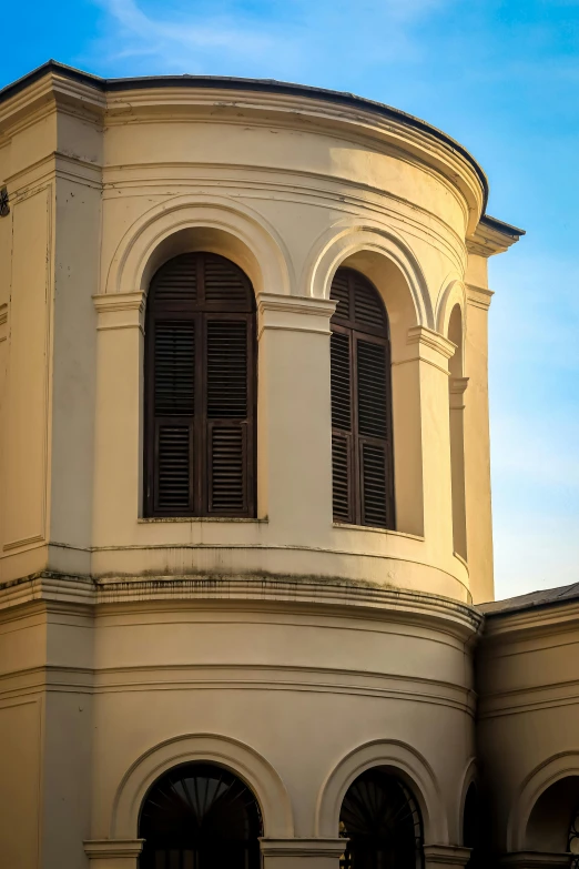 a building with a round roof and lots of windows