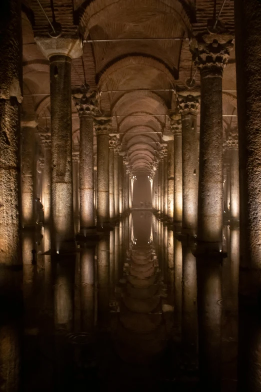 a very long hallway with water reflecting on it