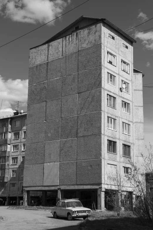 a large brick building with several windows near the top of it