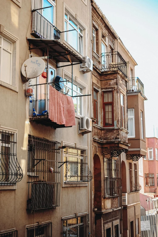 buildings on a street corner with several windows