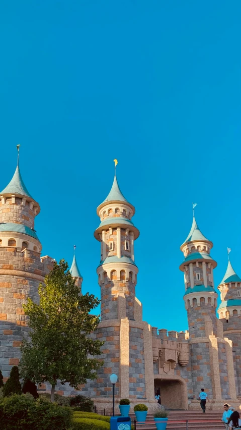 a building with three large towers and two small round towers