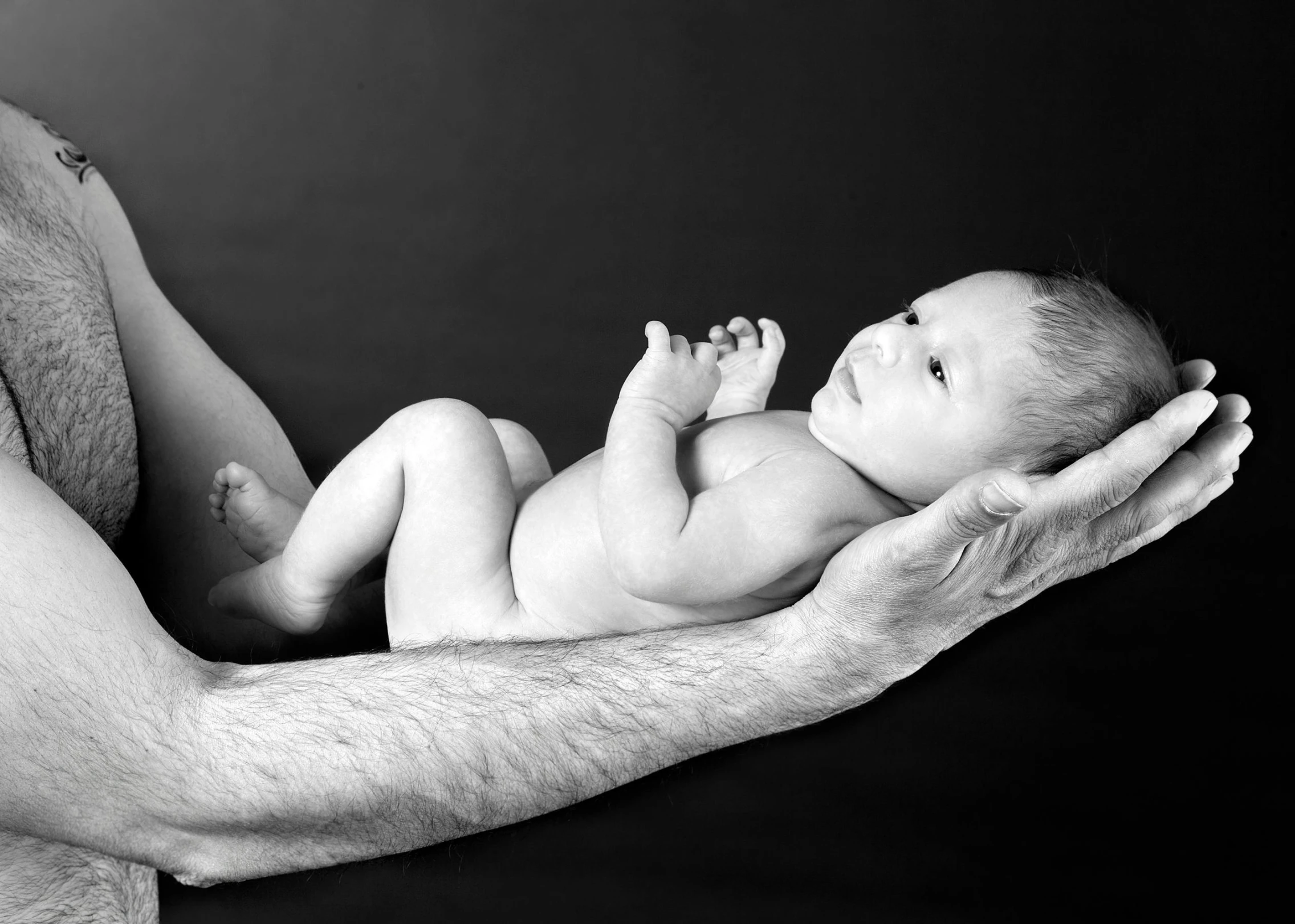 a baby in his father's hands