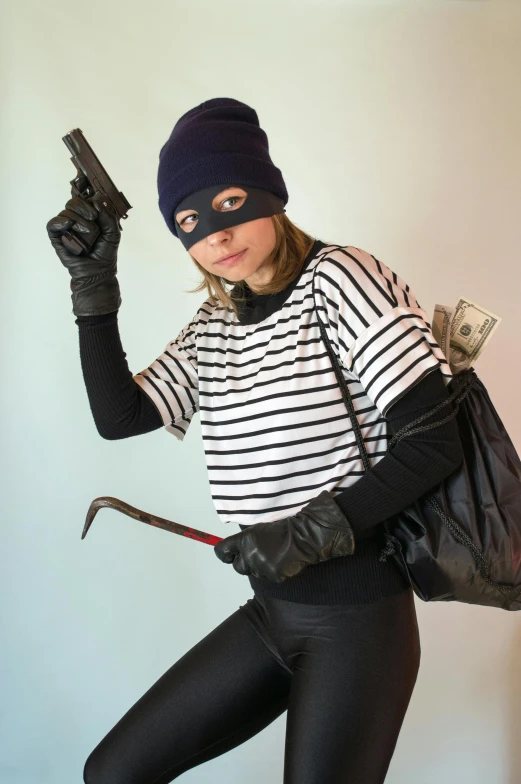 a  is dressed as a robber with money