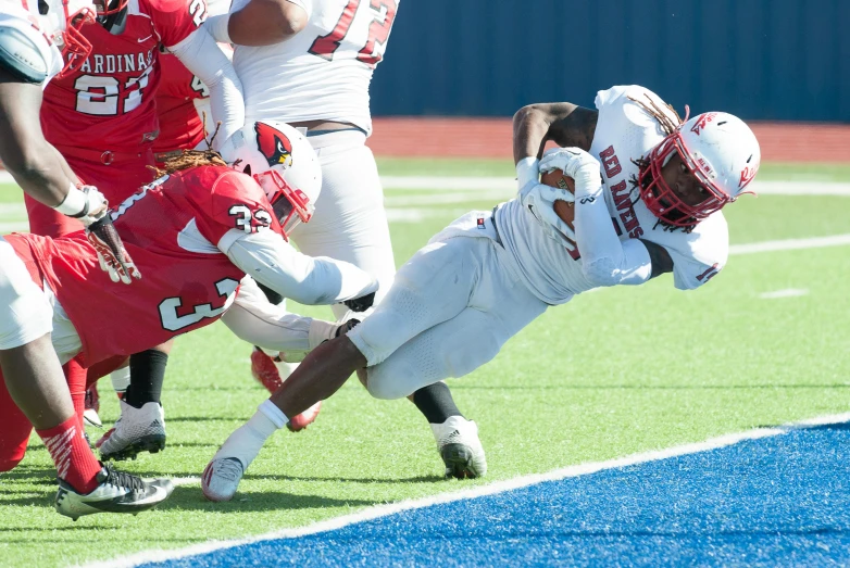 a football player falling off his knees