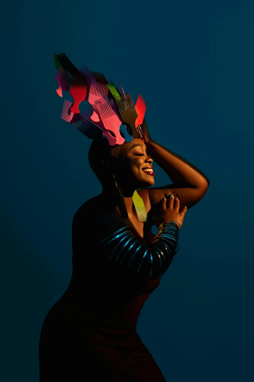 a woman wearing an animal headdress and standing with her hands behind her head