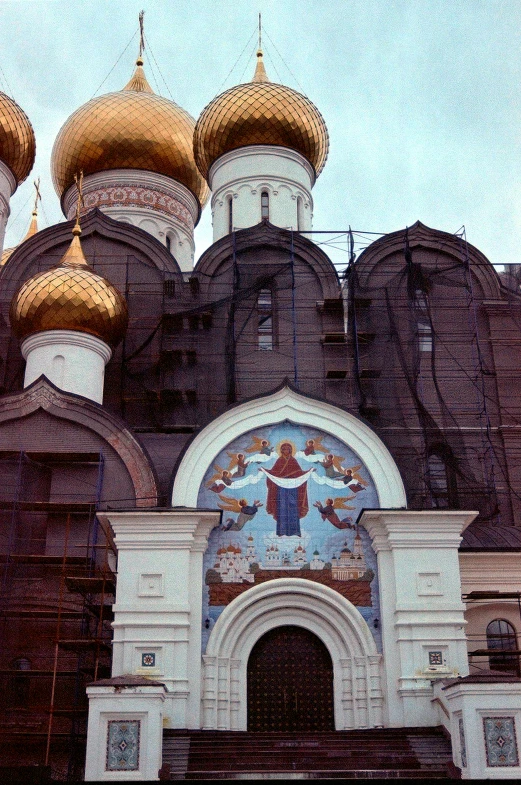 two golden domes on the top of a building