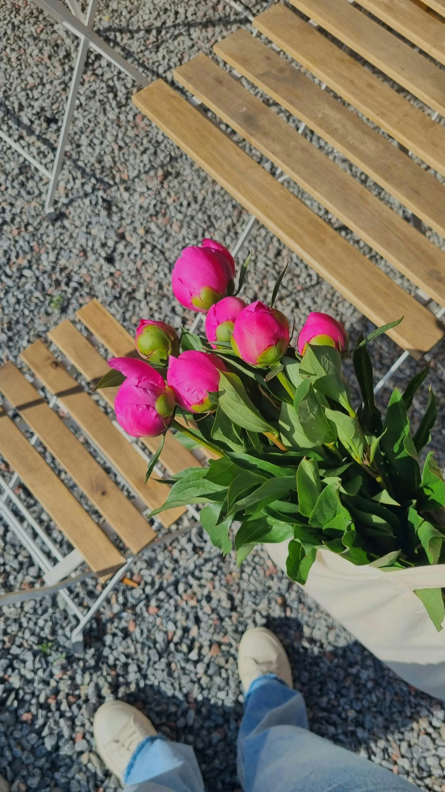 a person is sitting in a chair with a flower bouquet