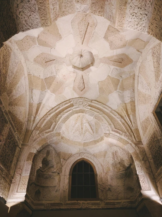 a large white vaulted ceiling with many windows