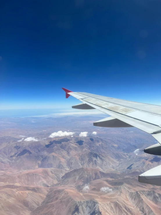 there is a plane with a view of mountains from the airplane