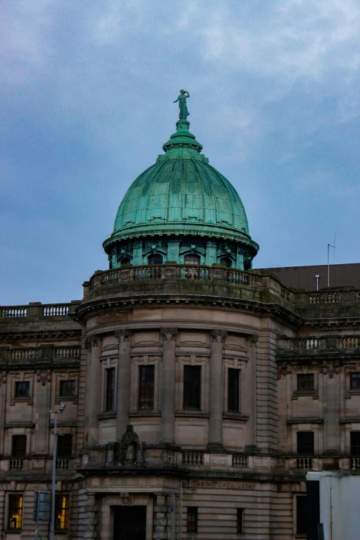 a very large dome with a weather vein on top