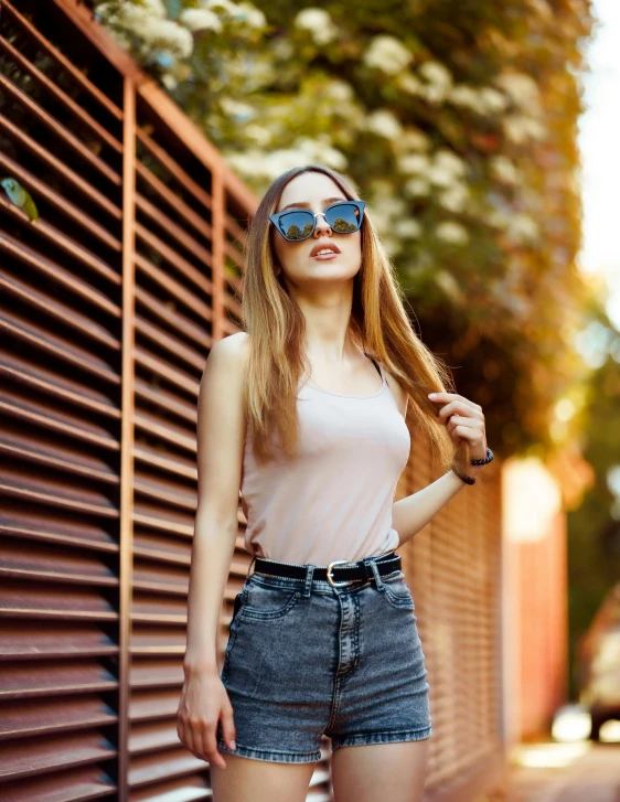 an image of a woman that is holding onto sunglasses
