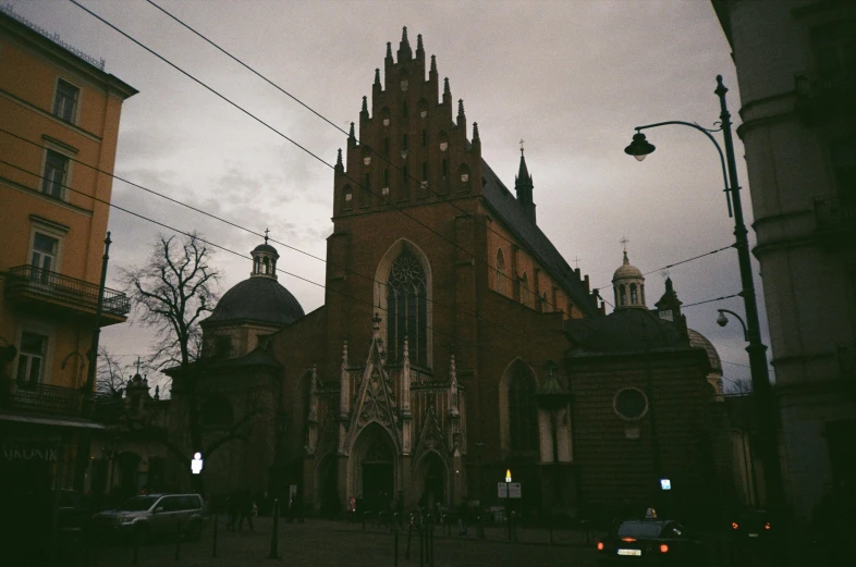 a church stands out against the background of two brown buildings