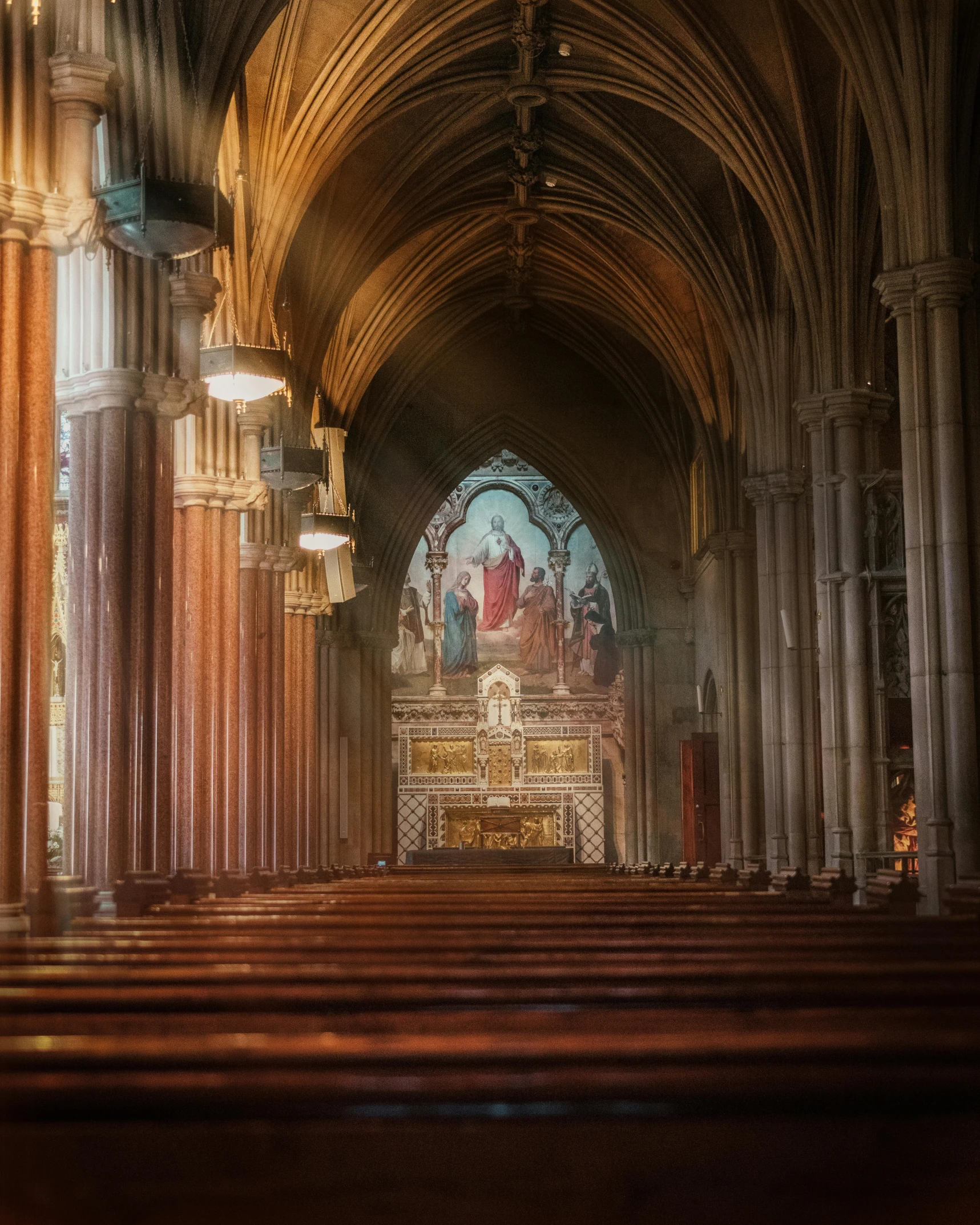 church pews and stained glass windows during daytime