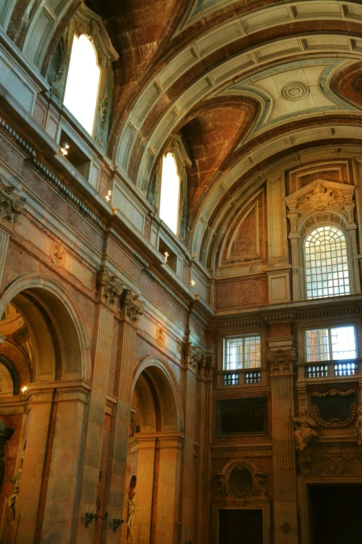 a massive room with tall ceilings and arches