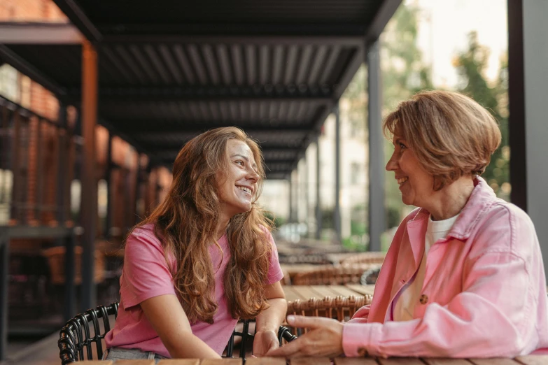 a couple of women that are sitting down