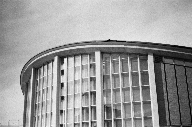 an airplane that is flying in the sky over some buildings