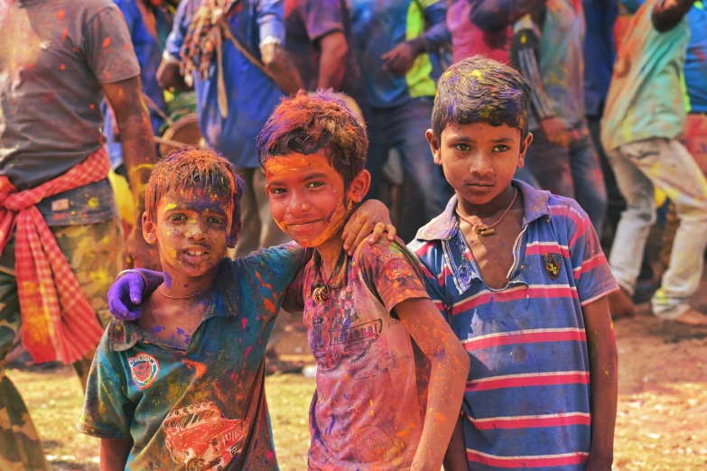 two children playing with color while others watch