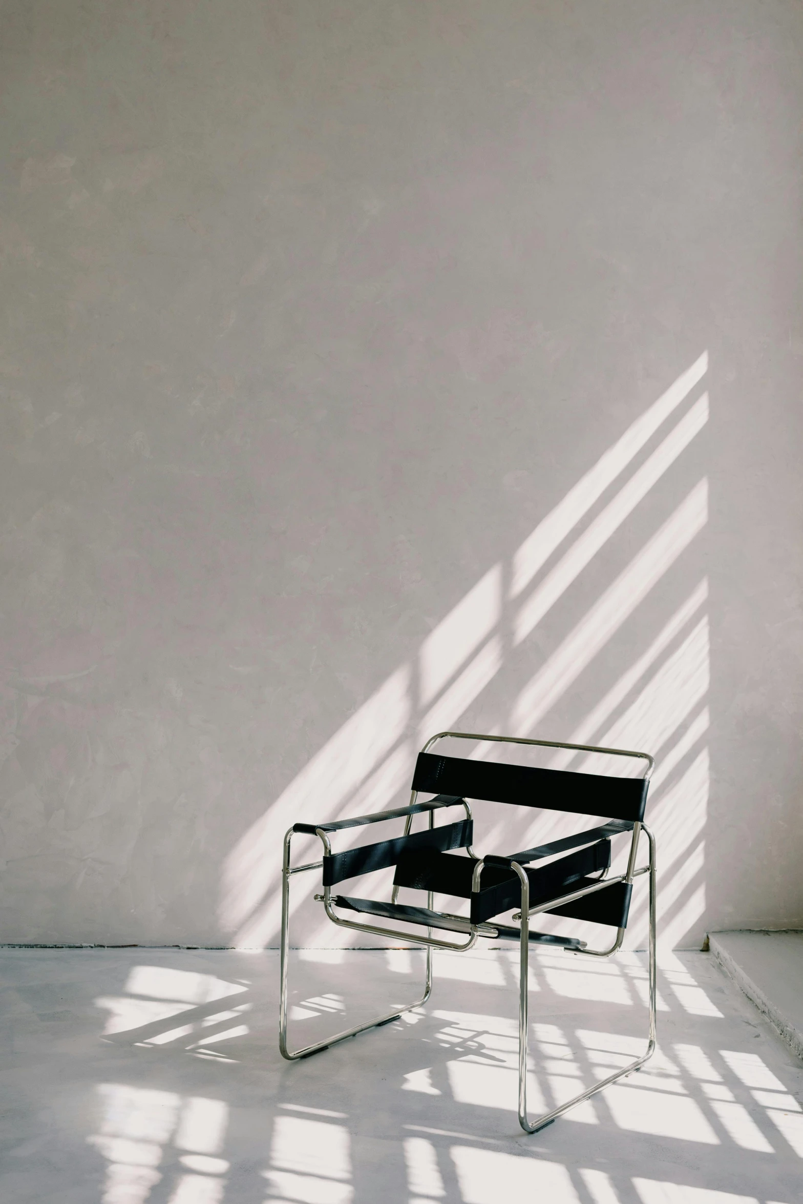 a chair sitting in front of a wall