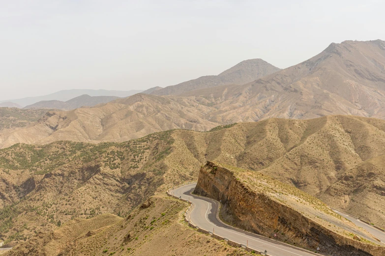 the mountainous road is winding in to the mountains