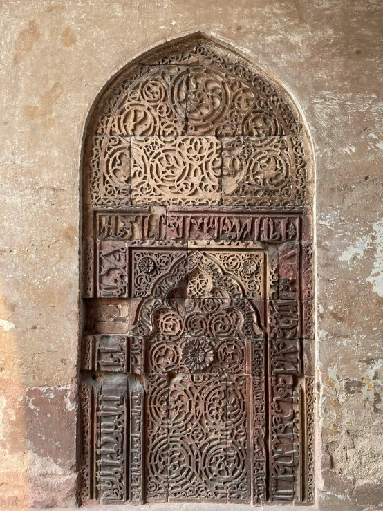 the carved doors and windows are ornately decorated