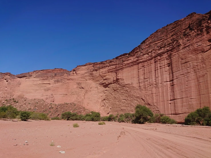 some large hills are shown against a blue sky