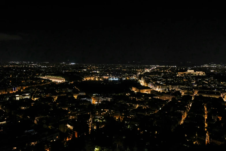 a city view lit up at night with buildings visible