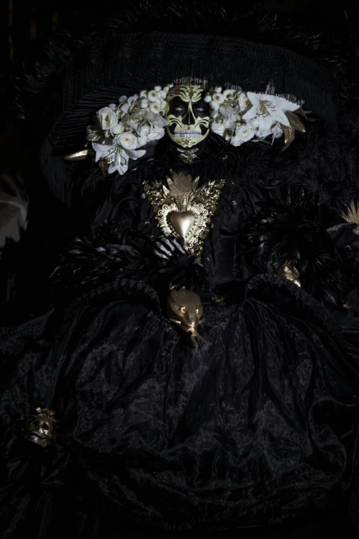 the black costume has white flowers in it