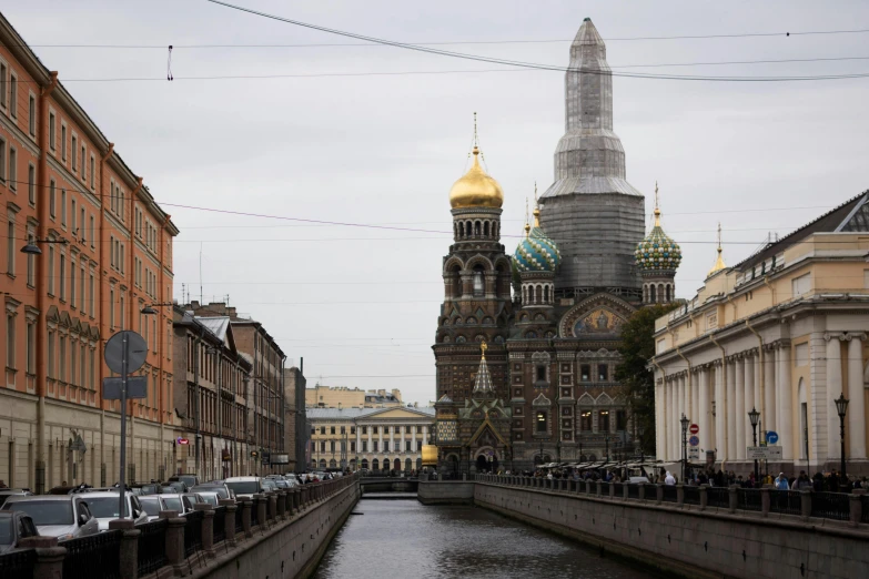 an urban canal with a cathedral on the far side