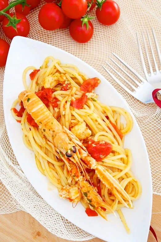 a plate with spaghetti and chicken on it