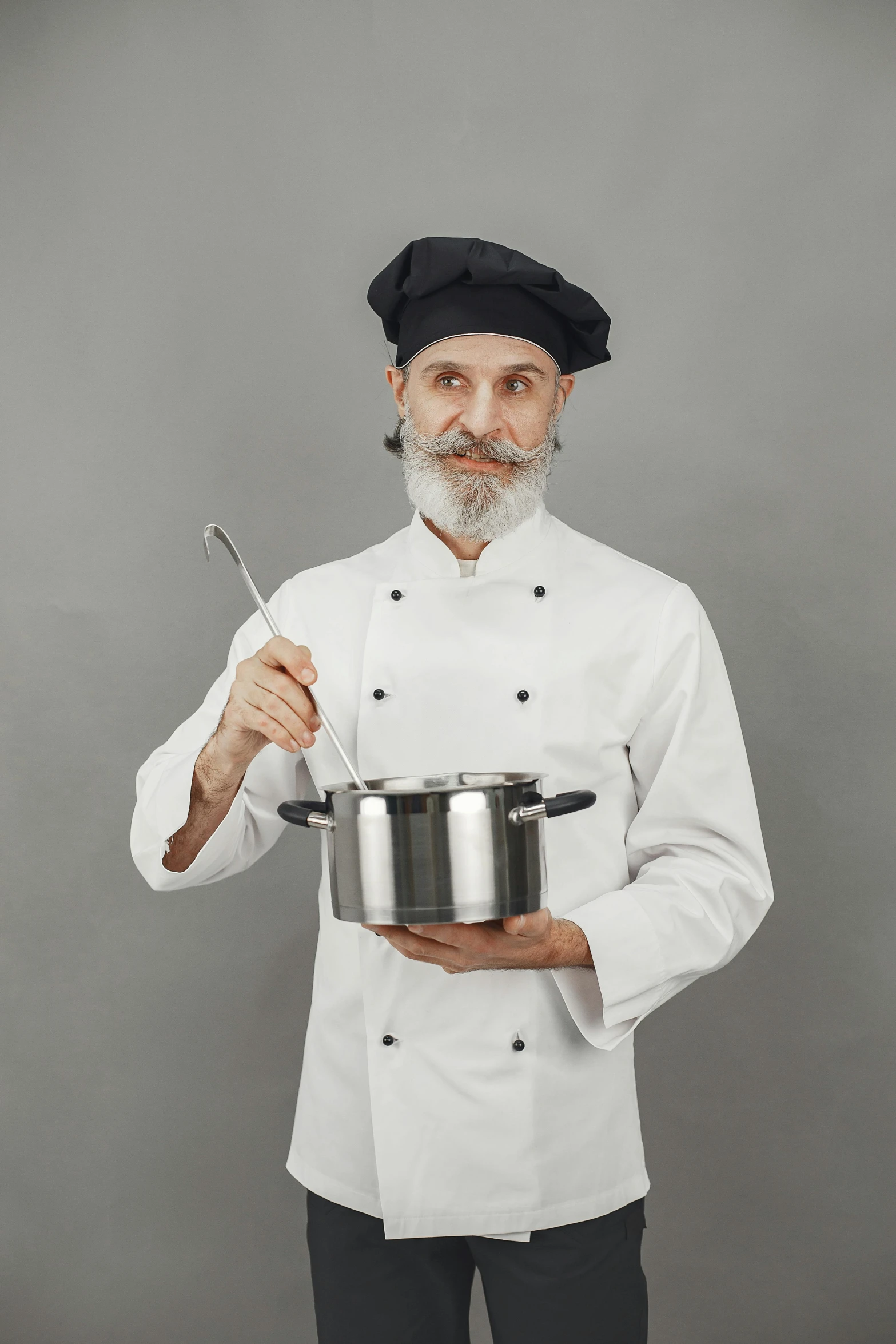 a chef with a pot and a spoon in his hand