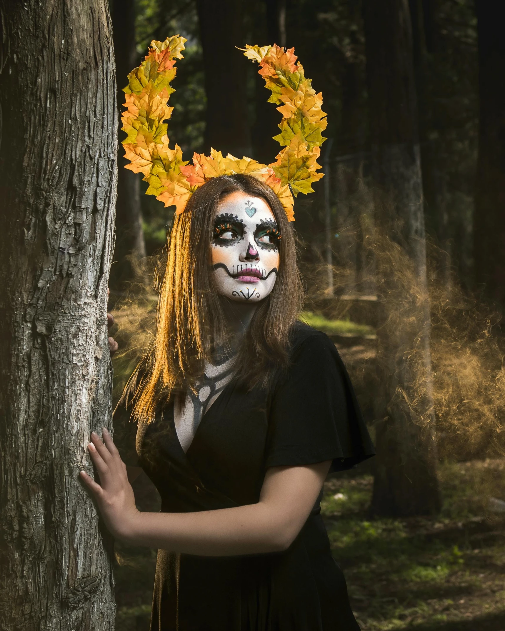 the woman is wearing face paint and wreaths