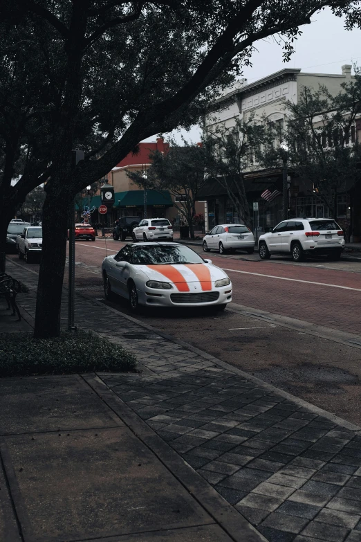 two cars sitting on the side of a street