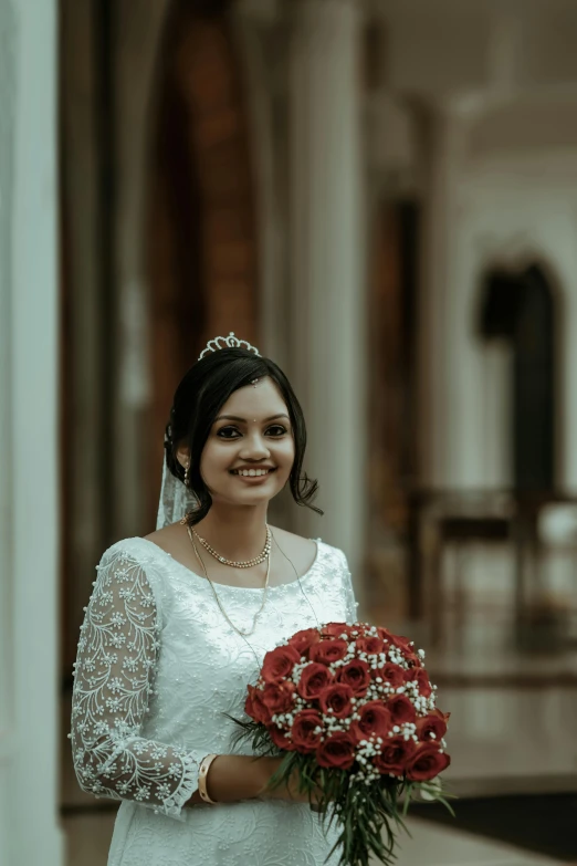 bride in a beautiful wedding dress standing at the entrance to the ballroom