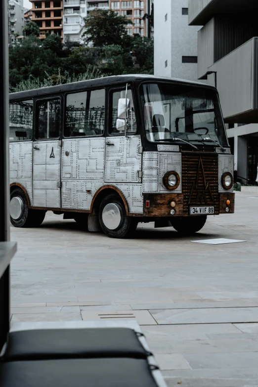 this bus is made out of discarded pieces of newspaper