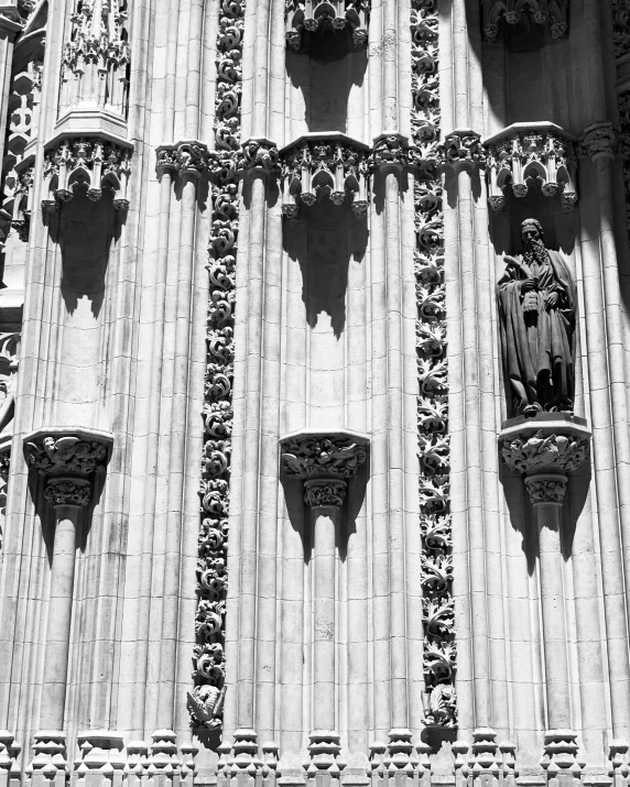 black and white pograph of decorative decorations on the side of a church