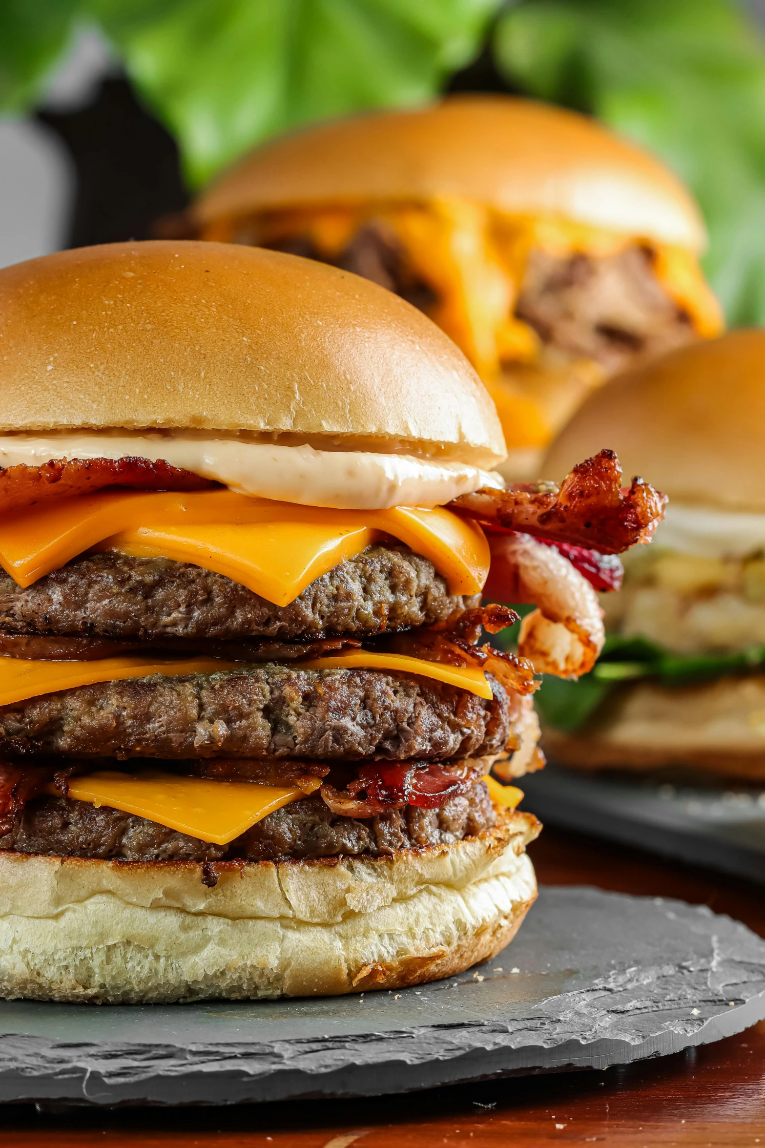 two cheeseburgers that are on a plate