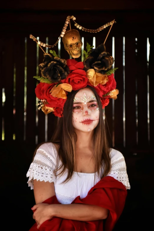 a girl with makeup and a skull on her head