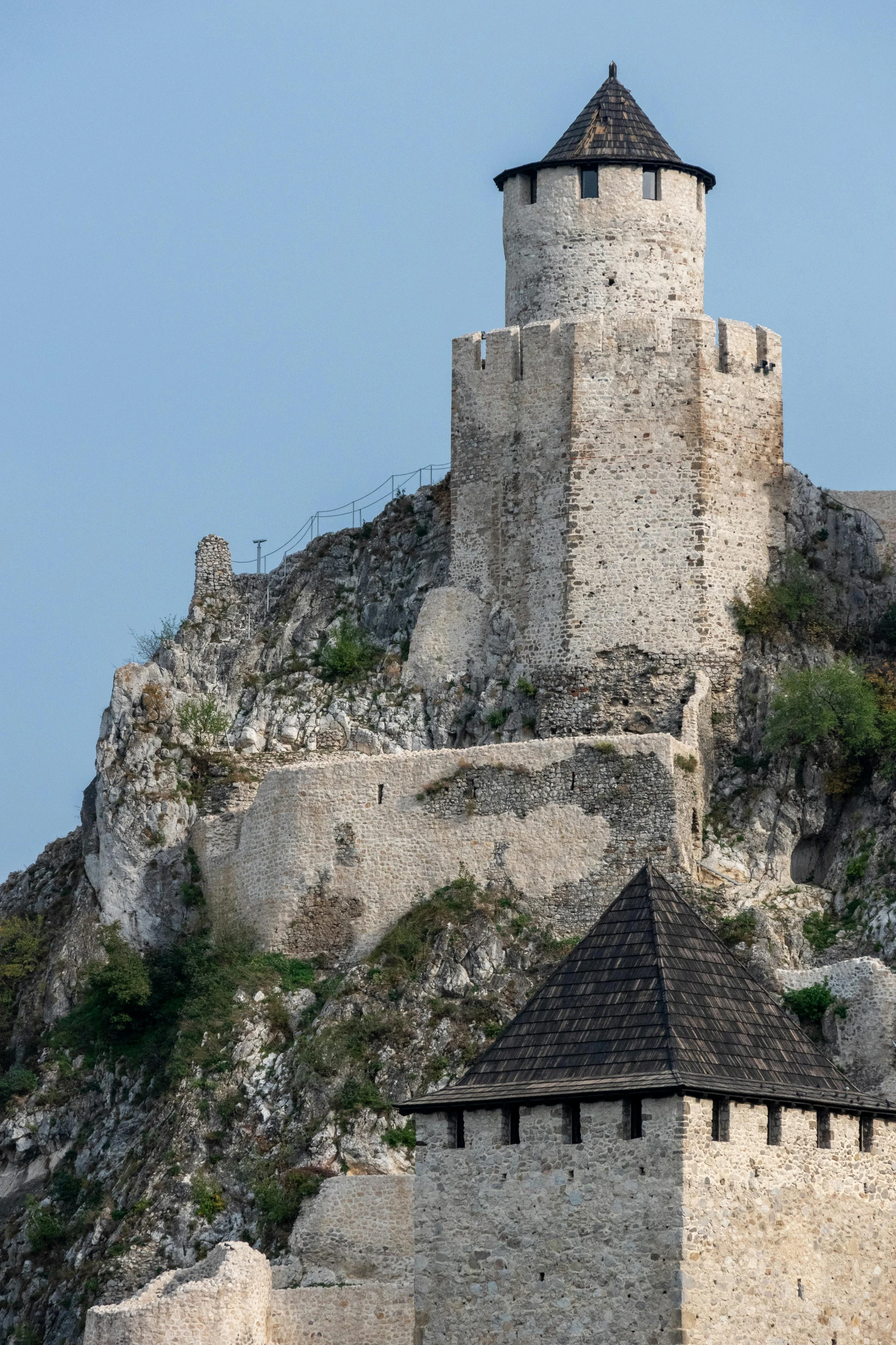 a small old castle built into the side of a mountain